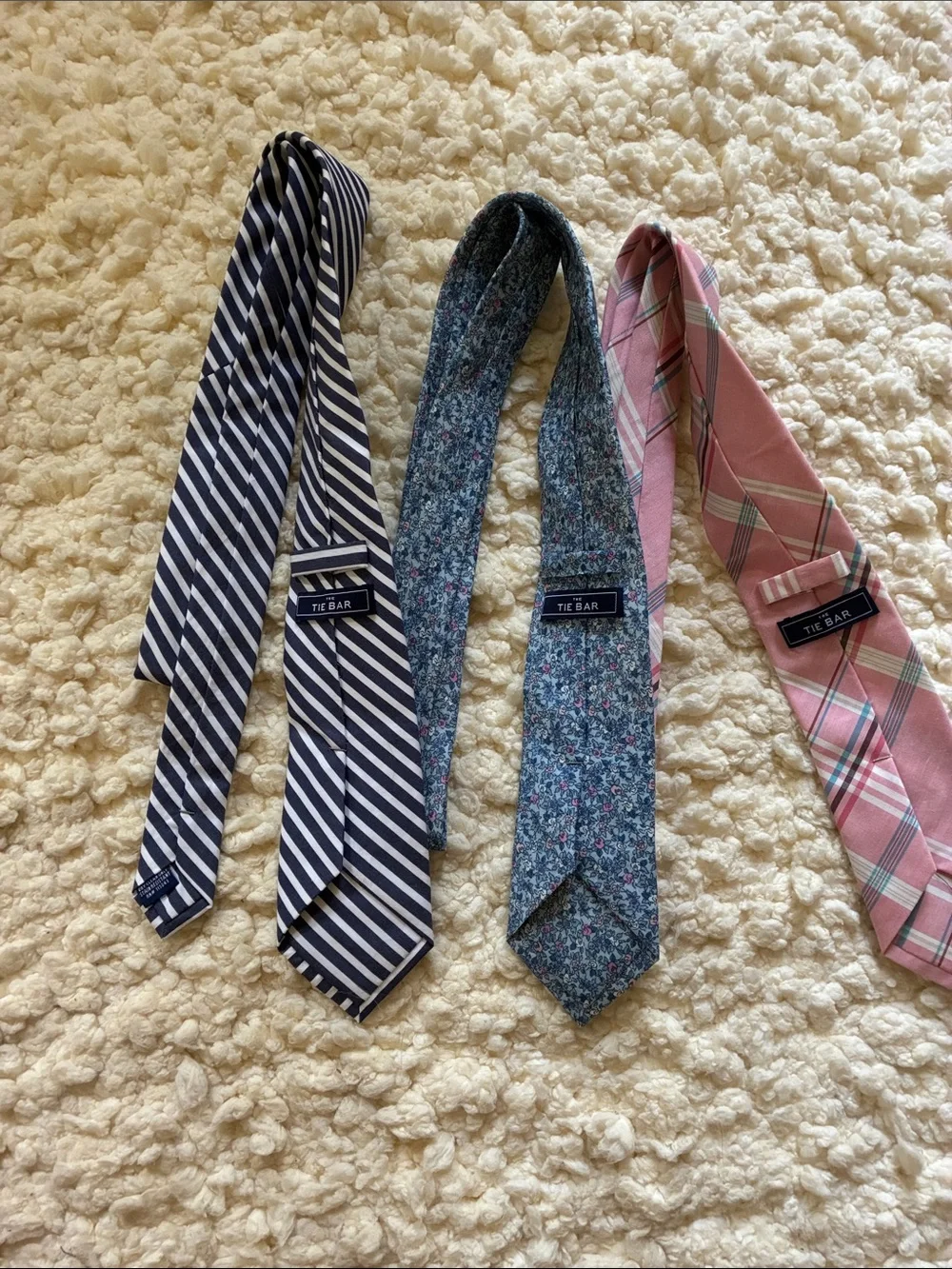 The Tie Bar Navy Stripe, Blue Floral, and Pink Plaid Neckties